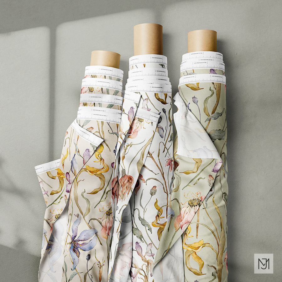 Three rolled fabric bolts in the dry flowers pattern shown in cream, white, and sage green colorways, unrolled ends draped down