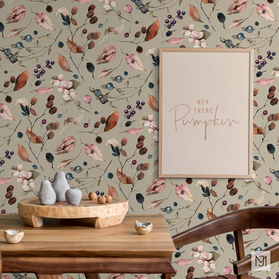 Autumn Fall Leaves pattern as wallpaper behind a dining table, with a framed print and small sculpted pears and apples on the table.