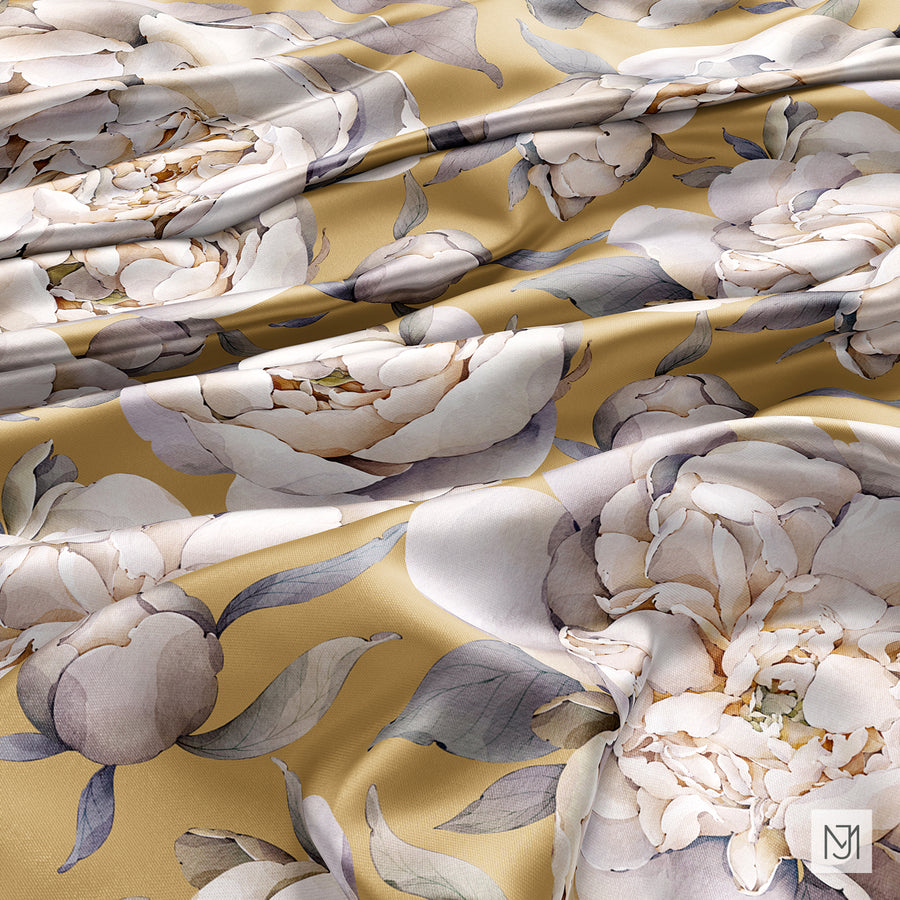 Mustard gold fabric draped in folds showing the ivory peony pattern