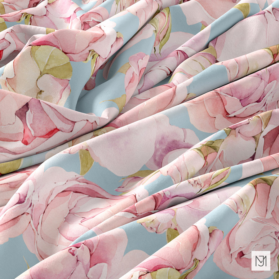 The Roses pattern on rippled fabric, in a pale blue colorway with pink roses across the folds.