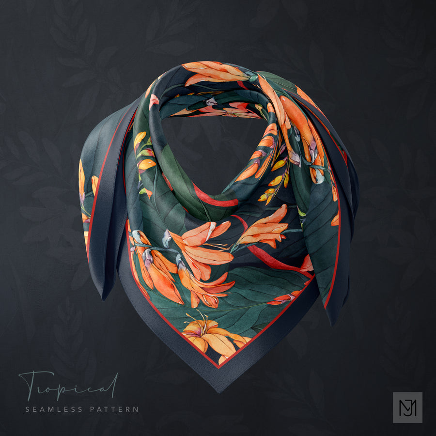 Tropical pattern printed on a silk scarf, knotted into a rosette, in a dark teal colorway with the same orange tropical flowers.
